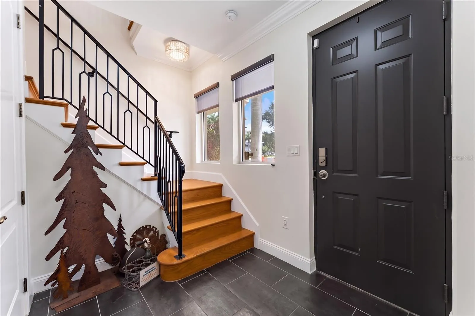 Front entry staircase + private elevator