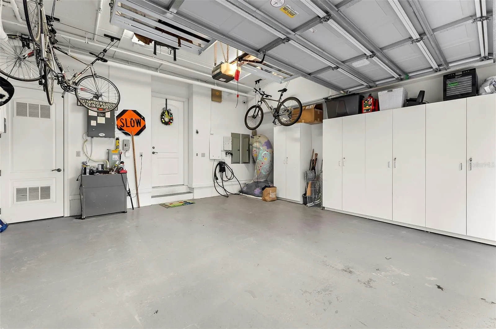 Private 2 car garage with storage + activity wall