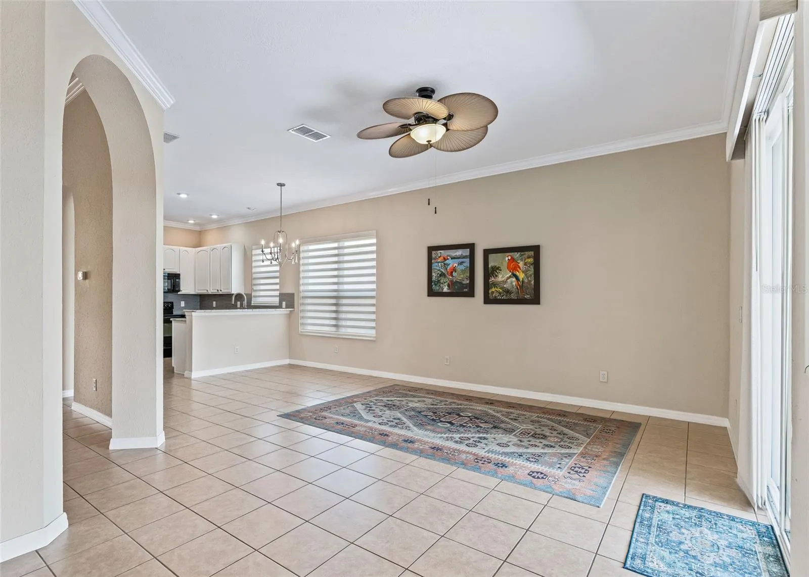 family rm w/Designer ceiling fan.