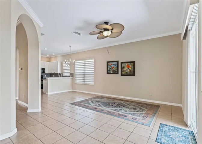 family rm w/Designer ceiling fan.