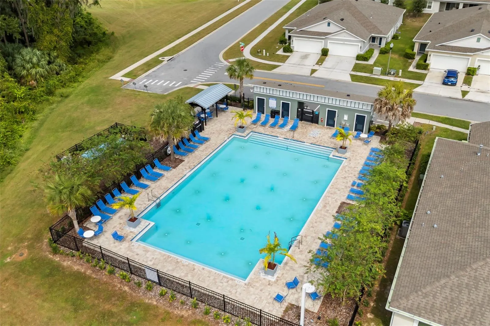 Another view of the community pool and spacious pool deck.