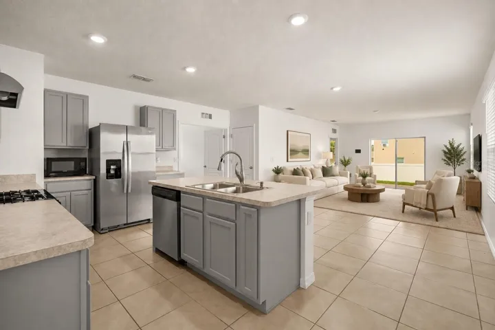 Virtually staged main living area showcasing a comfortable seating arrangement and the spacious open layout.