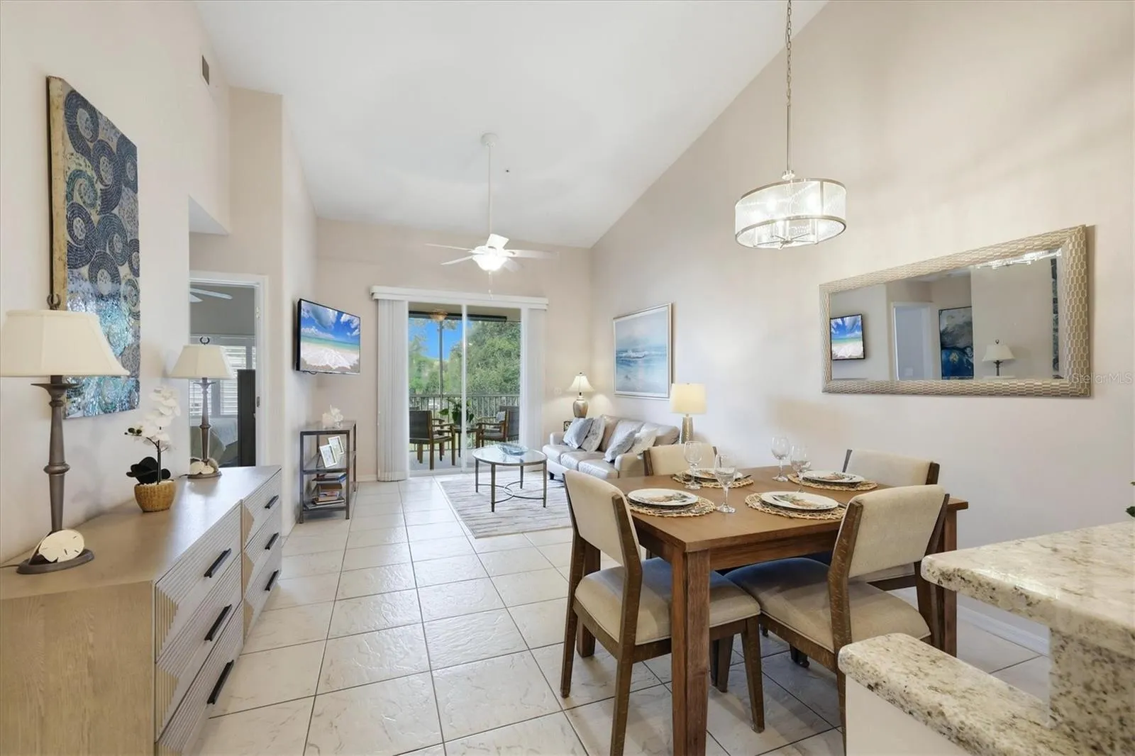 See the integration of the updated kitchen, dining and living rooms into a unified connective living area.