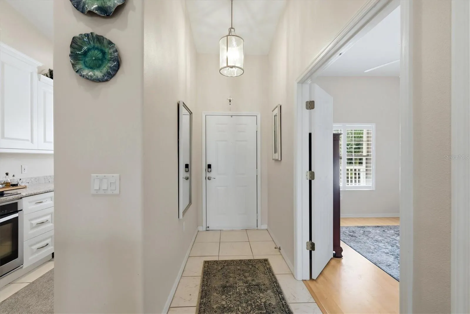 Interior front entrance with Second Bedroom and Kitchen.
