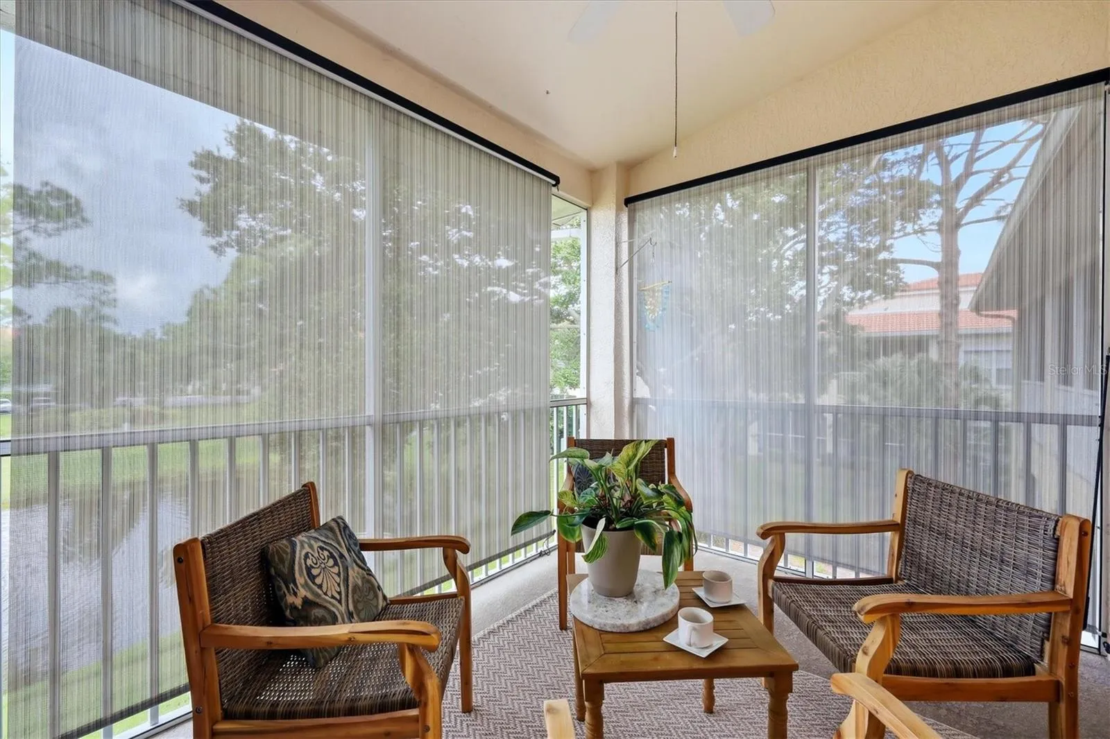 Sun shades and ceiling fan make the Lanai a pleasant place to gather the year through.