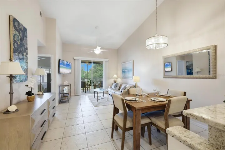 See the integration of the updated kitchen, dining and living rooms into a unified connective living area.