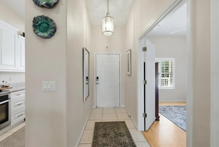 Interior front entrance with Second Bedroom and Kitchen.