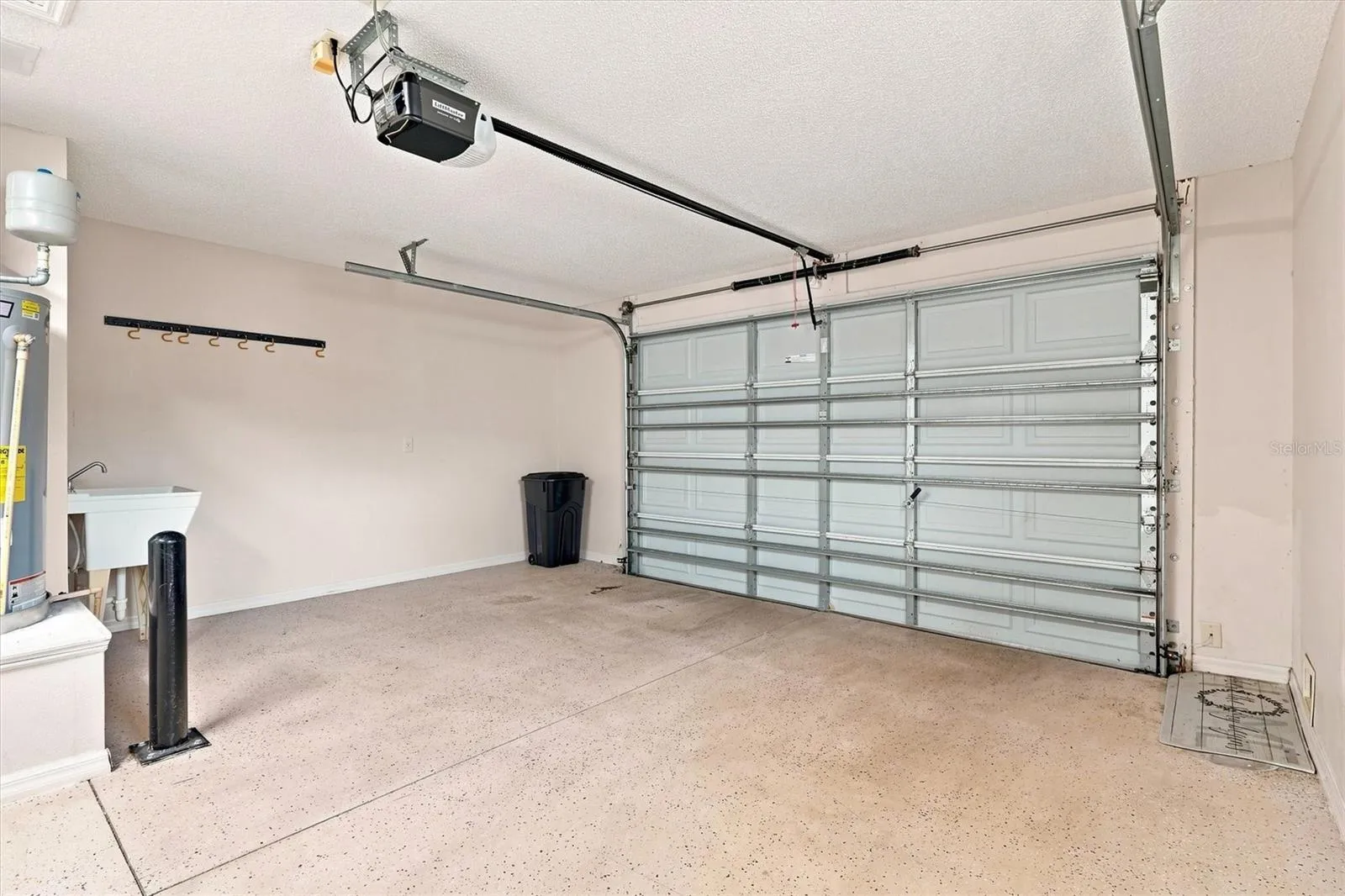 Garage: "One-car and golf-cart garage, Village of Summerhill home"