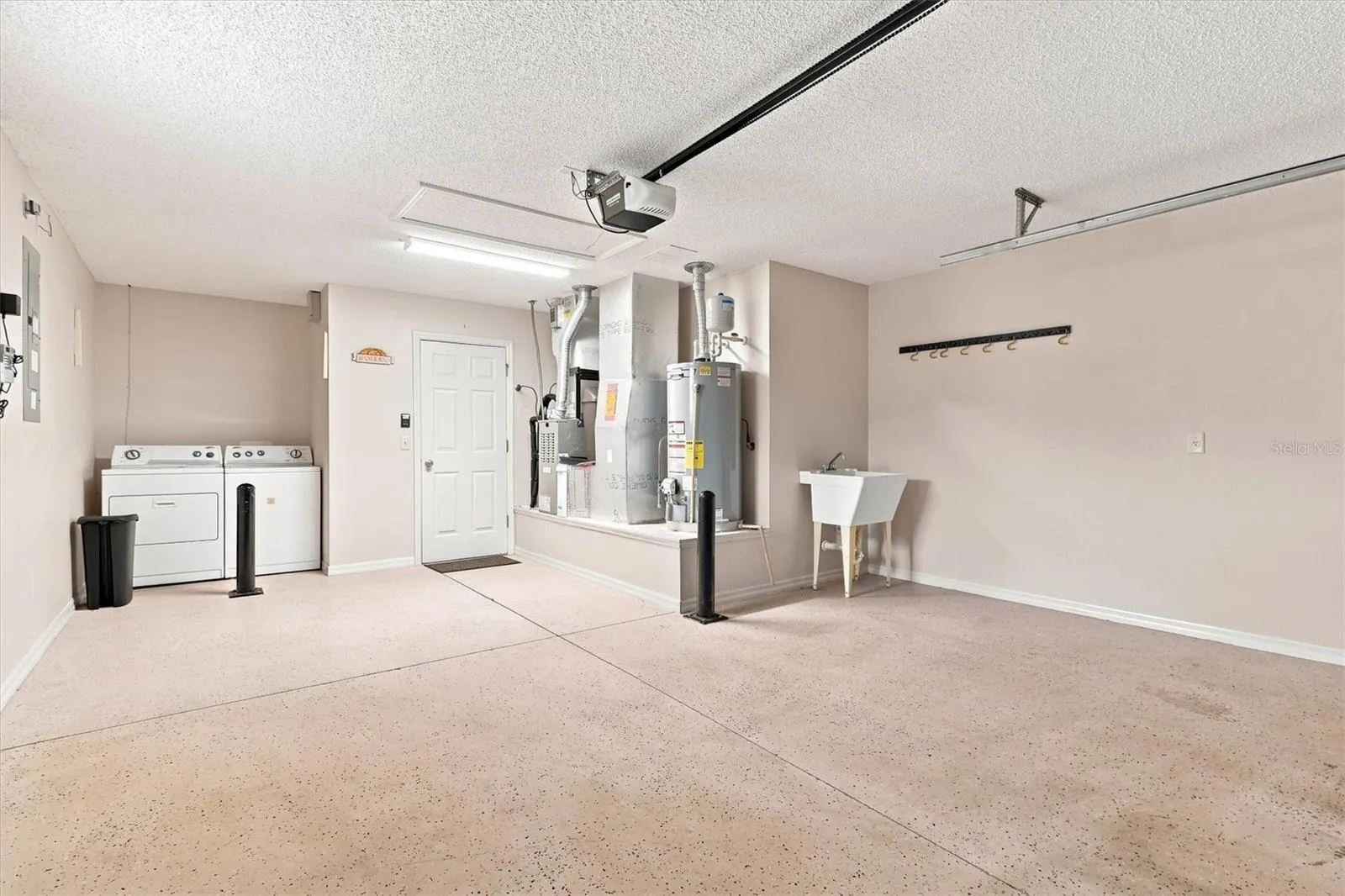 Garage: "One-car and golf-cart garage, Village of Summerhill home"