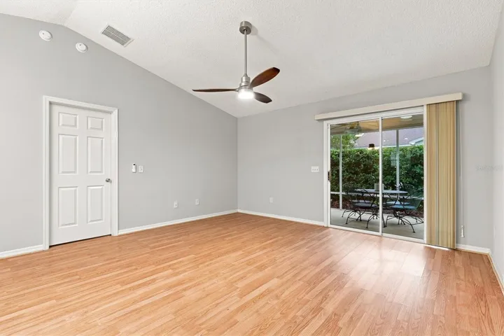 Living room: "Open living room with laminate flooring in The Villages Summerhill home"