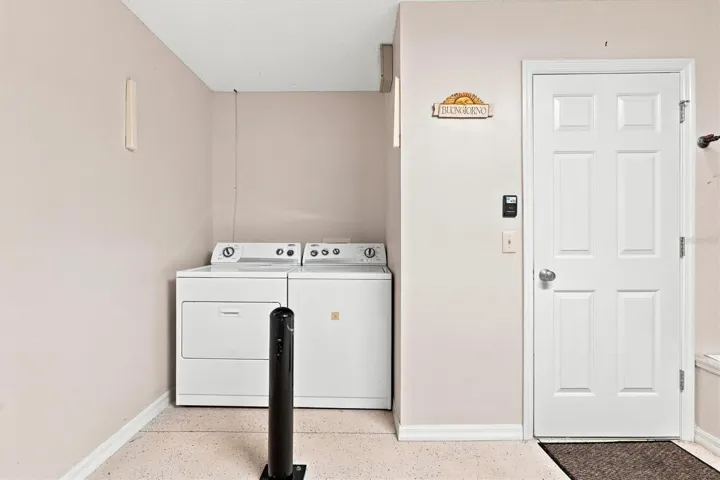 Garage: "One-car and golf-cart garage, Village of Summerhill home"