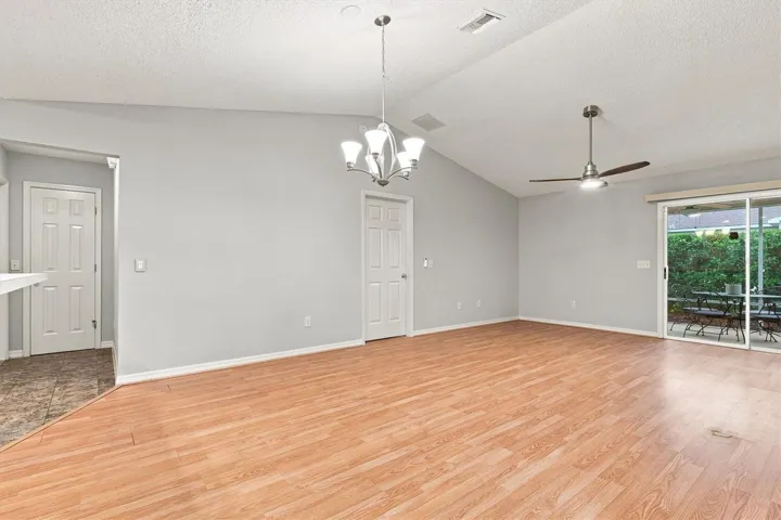 Living room: "Open living room with laminate flooring in The Villages Summerhill home"