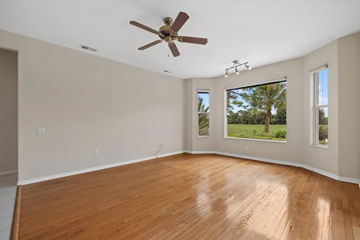 Family Room with Panoramic Window with View of 18th Fairway