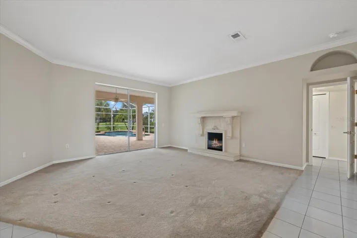 Living Room with Sliders to the Lanai &amp; Pool.