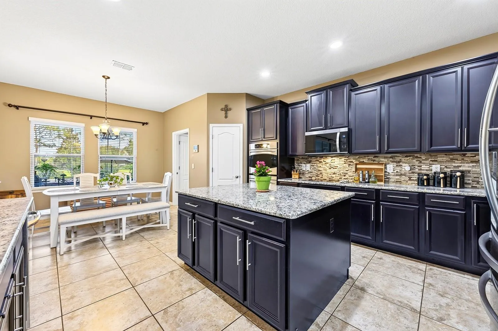 Kitchen is open to the family room as well as a casual dining space.
