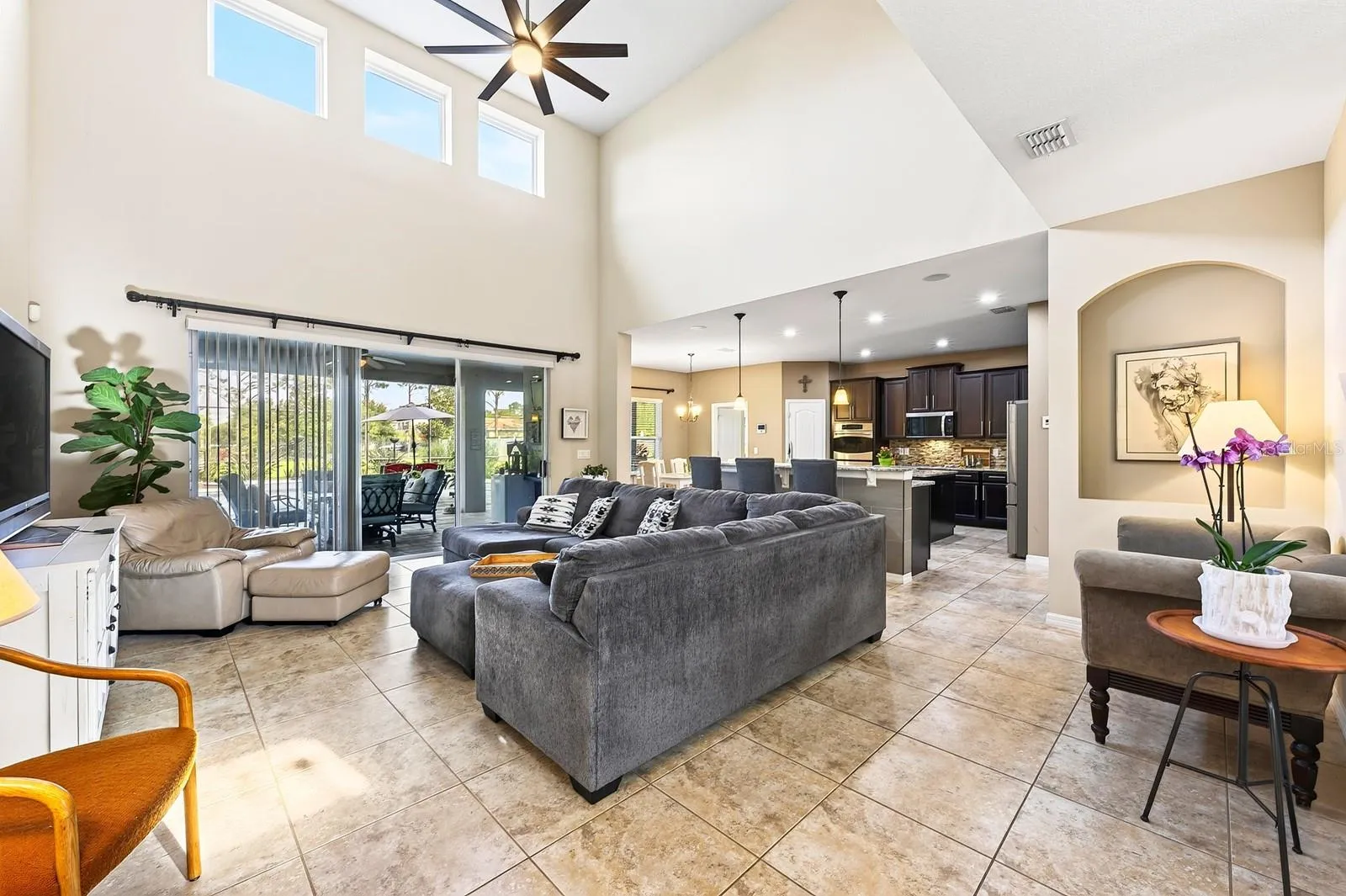 Natural light pours into the two story family room.