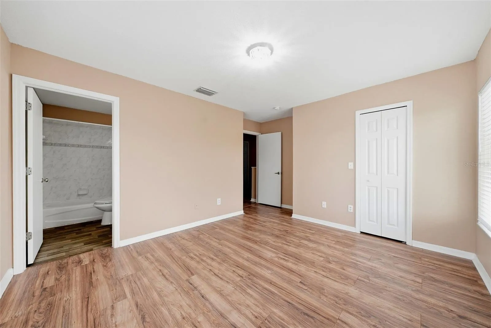 Primary Bedroom with en-suite bathroom and walk-in closet