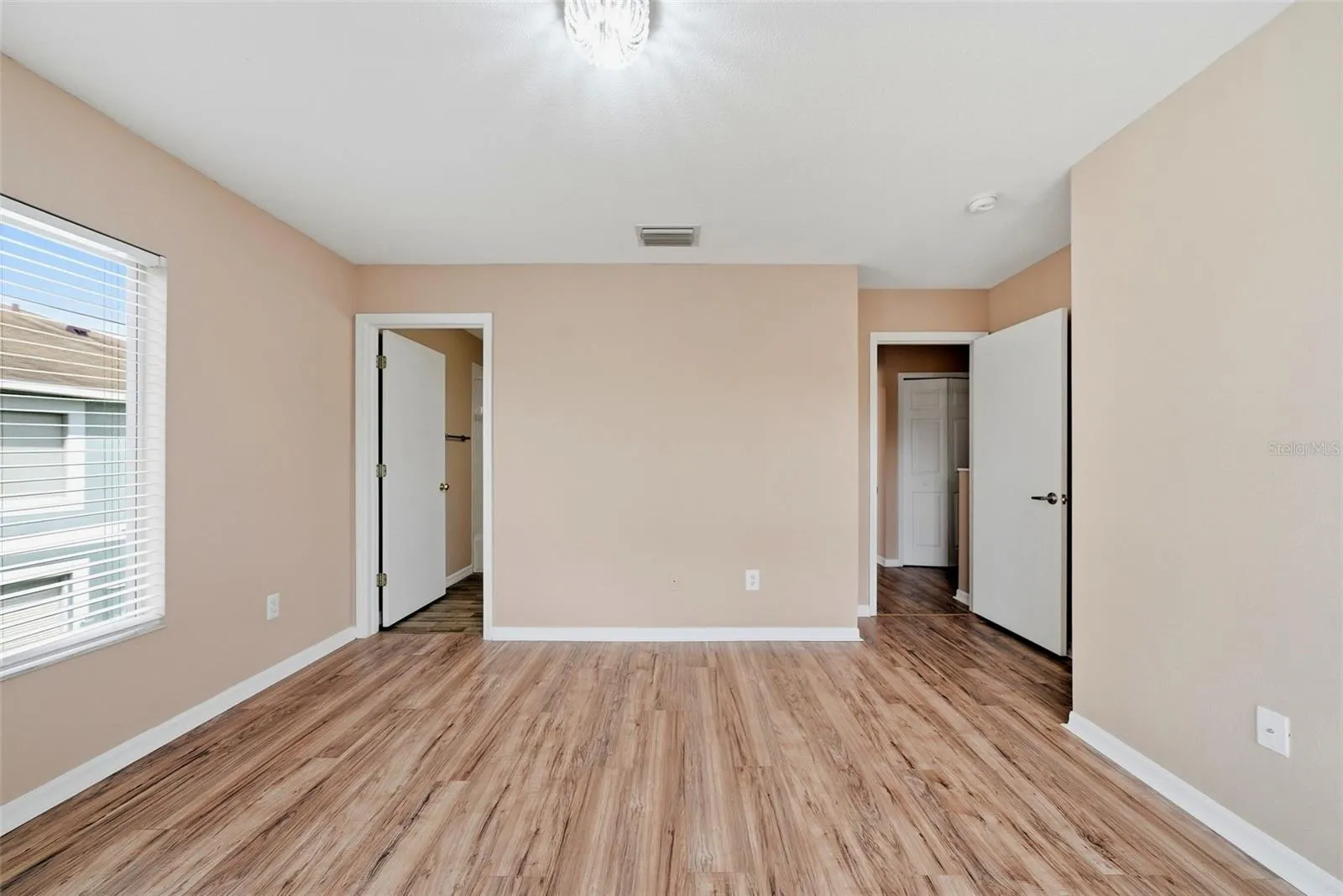 Primary Bedroom with en-suite bathroom and walk-in closet