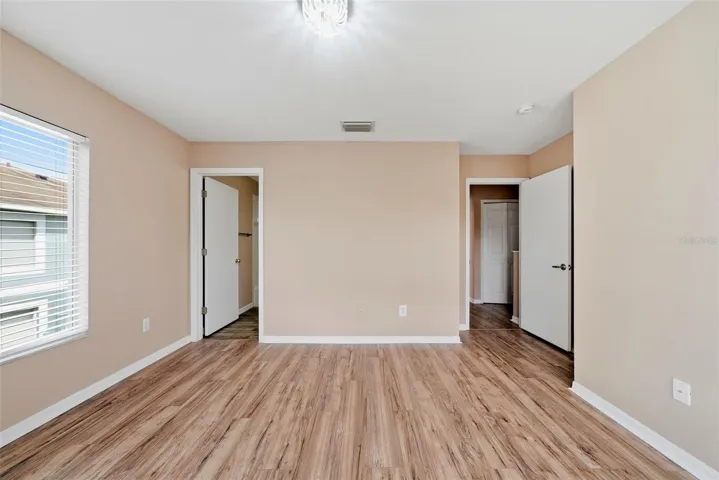 Primary Bedroom with en-suite bathroom and walk-in closet