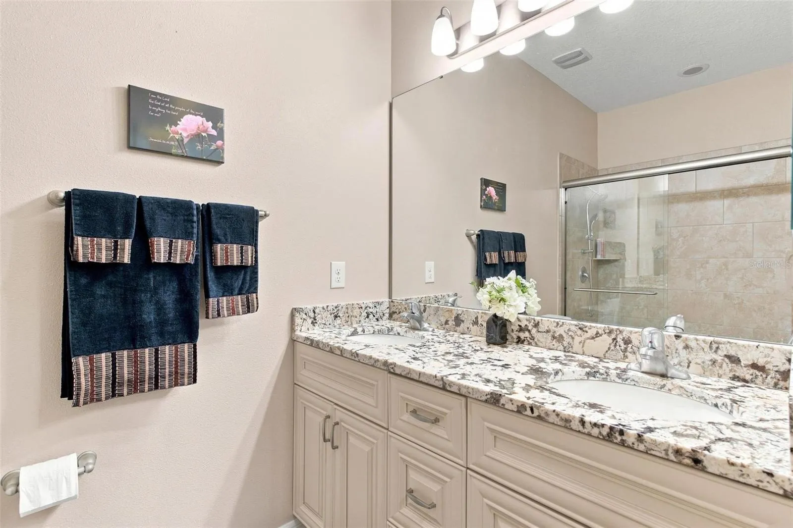 Primary Bathroom features walk in shower, upgraded cabinets, upgraded granite countertops.