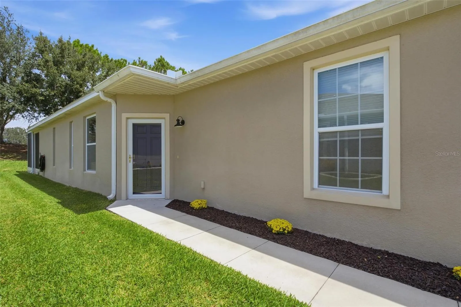 Walk way to exterior front entry into home