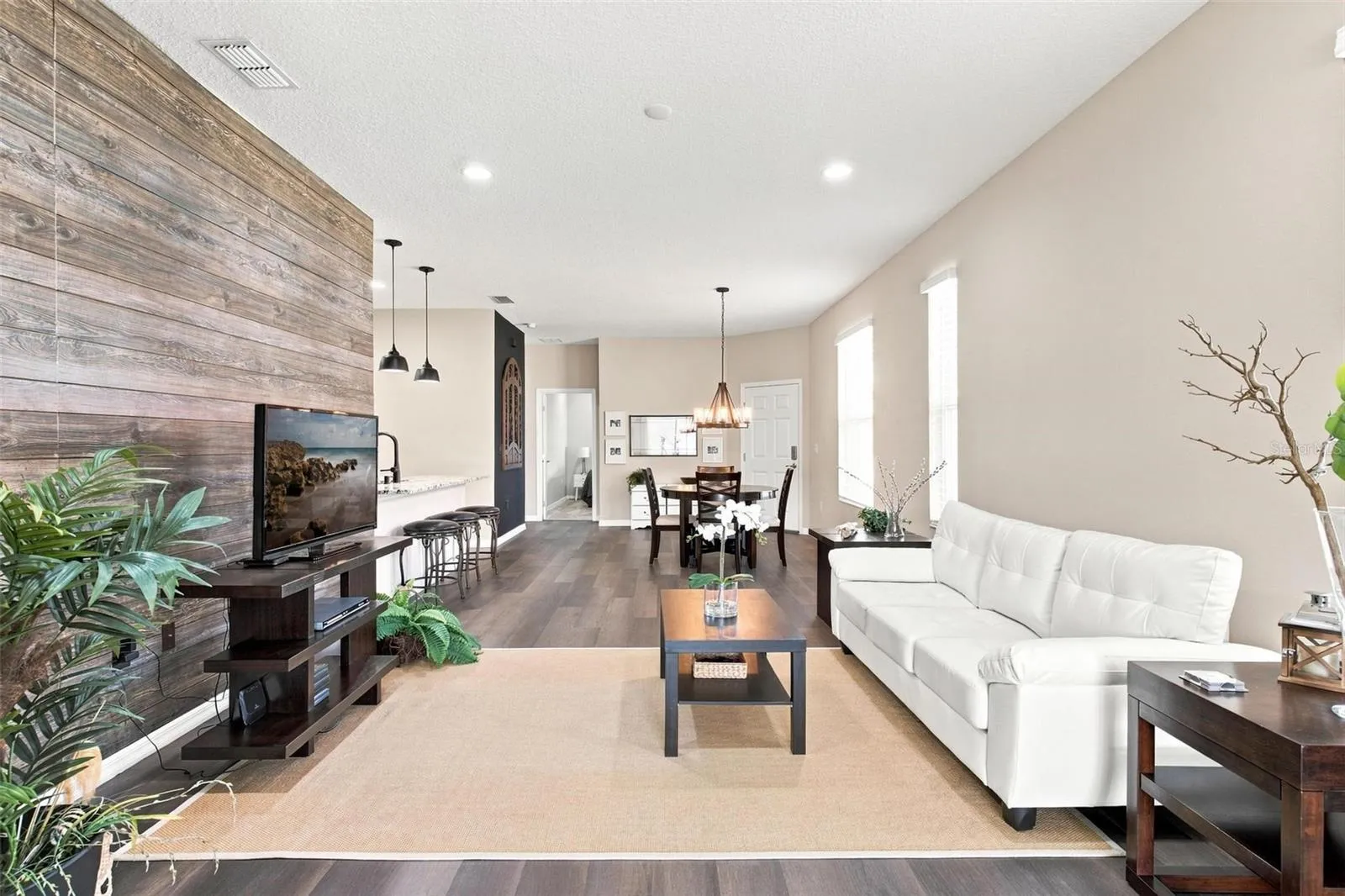 Open Living Spaces and Split Floor Plan. Living Room overlooks dining and kitchen and features luxury vinyl flooring.