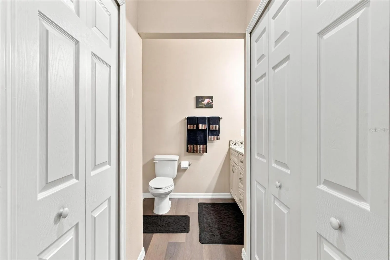 Primary Bedroom features 2 closets and entry into primary bathroom