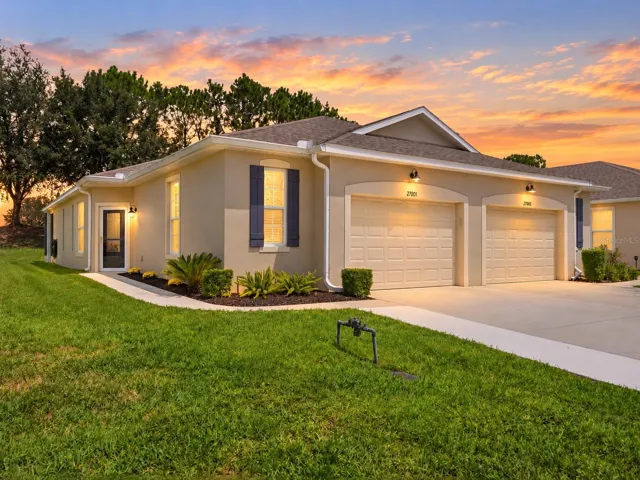 Exterior front of home. Extended Driveway leads to the front entry way of this 2 bedroom, 2 bath villa.