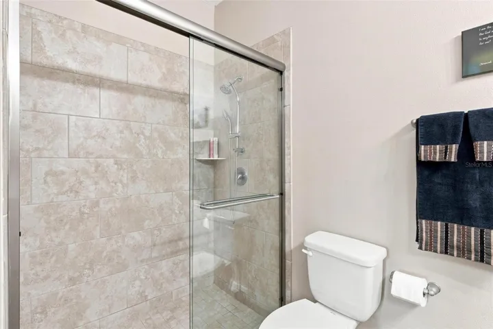 Primary Bathroom features walk in shower, upgraded cabinets, upgraded granite countertops.