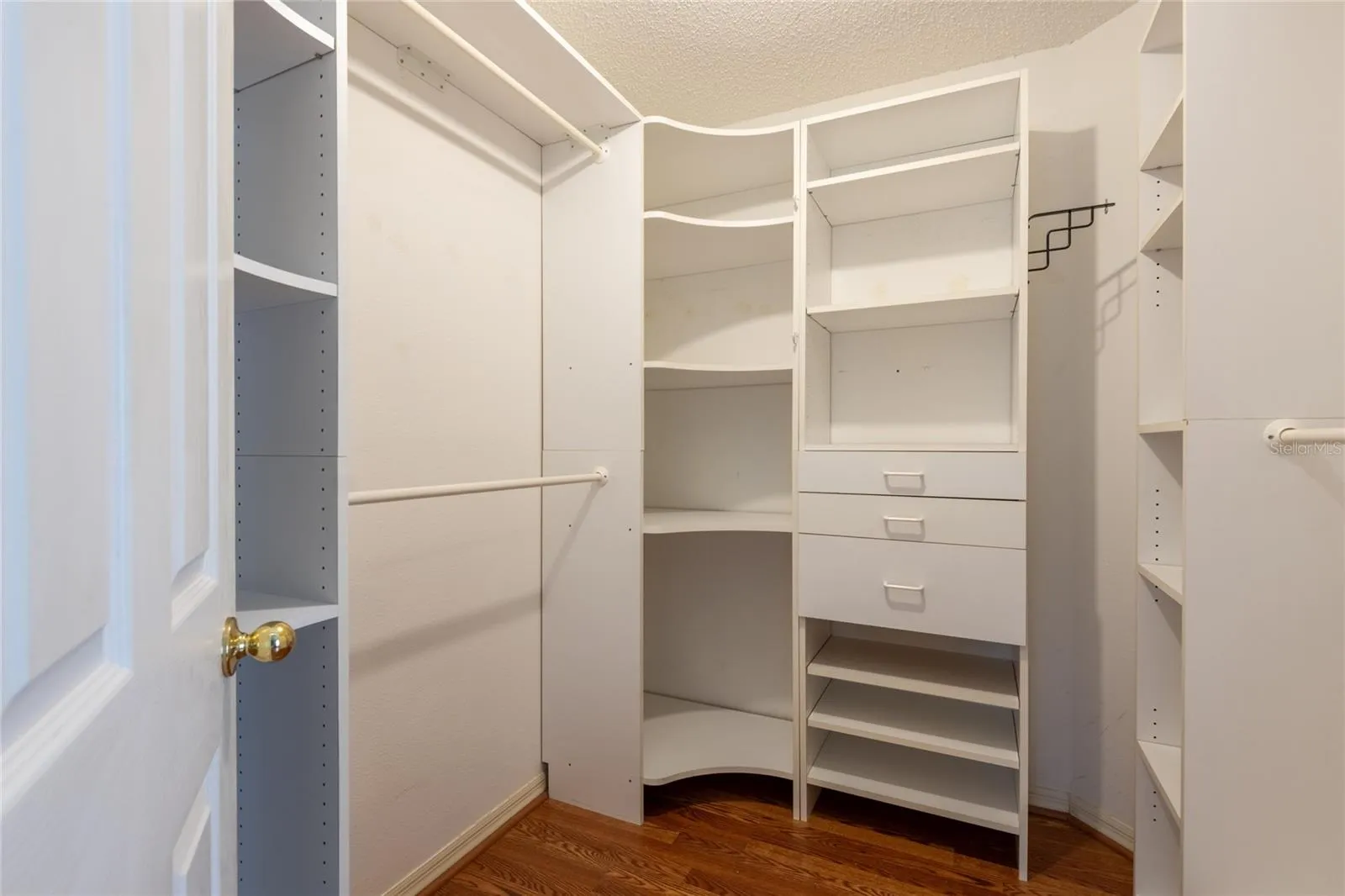 Primary bedroom closet with lots of storage!