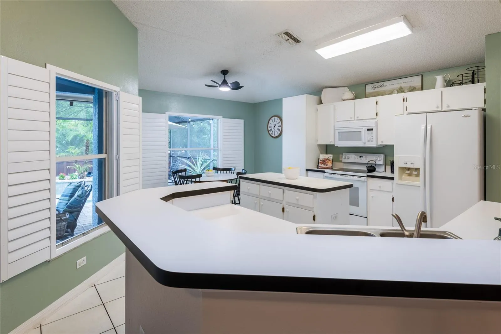 Kitchen has lots of cabinets and counter space for the cook in the family!