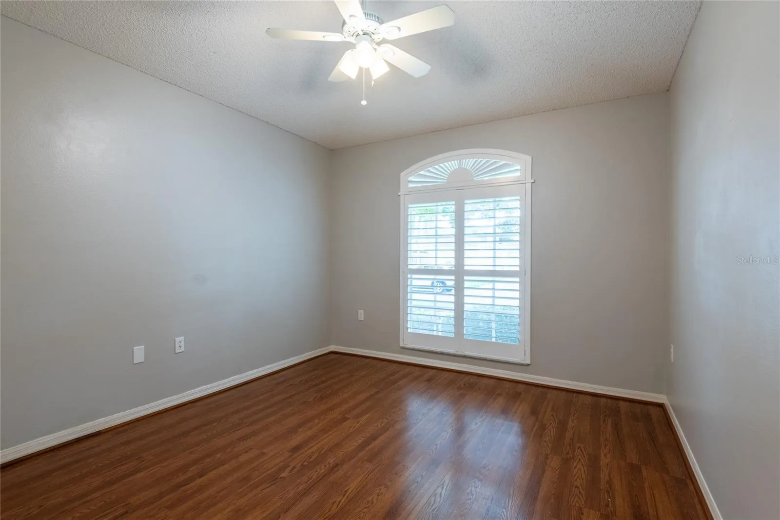 Front bedroom with plantation shutters.