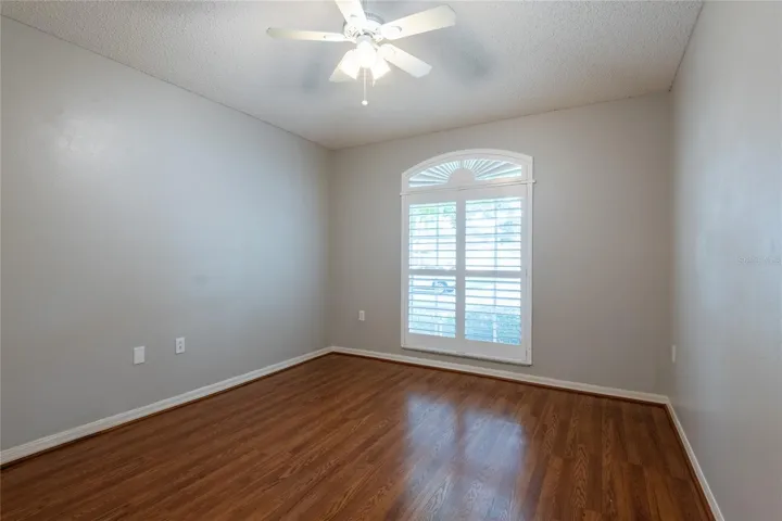 Front bedroom with plantation shutters.