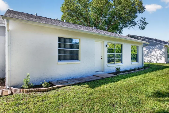 Rear Side View- 9545 Danville Court, #42, New Port Richey, FL 34655Wedgewood Village Condos in Heritage Lake