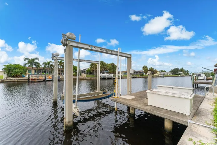 Boat lift, dock and storage containers