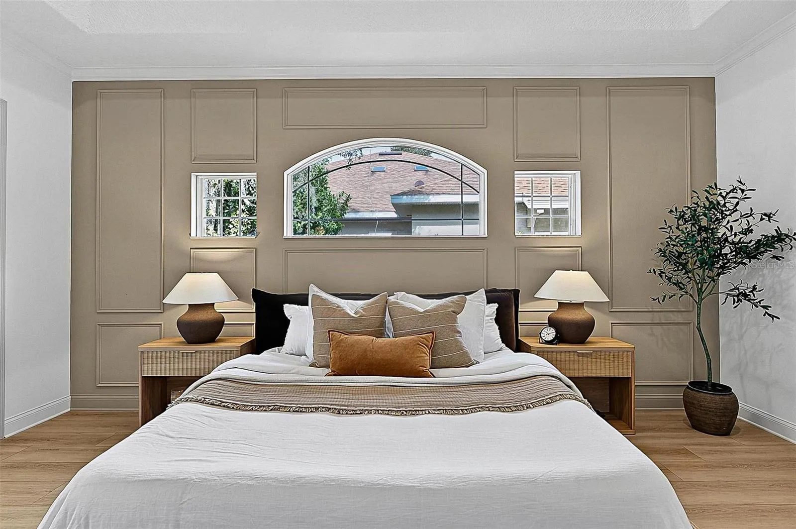 A piece of heaven in the Master Bedroom Retreat with transient window bringing in natural light. Sliders go out to the solarium