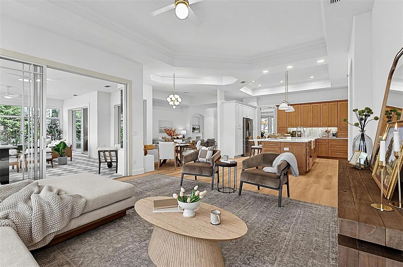 Family room, cozy breakfast nook, kitchen and triple sliders going out to solarium