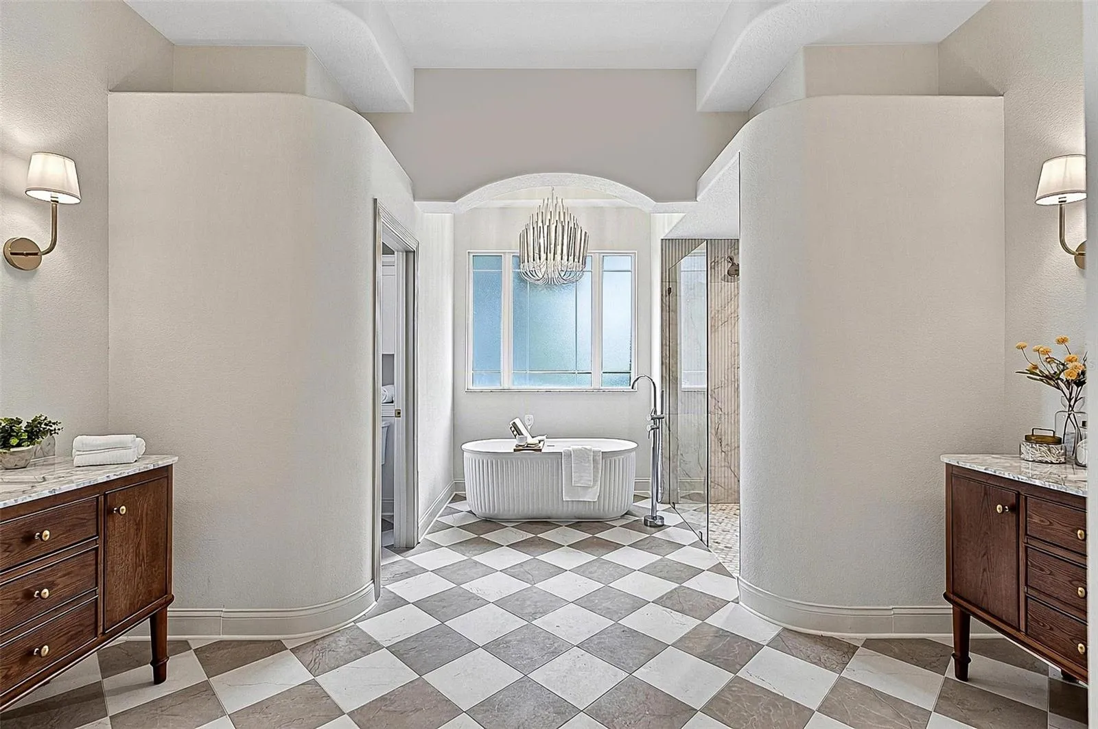 Looking like an upscale magazine, this formal Master Bath gives all the spa vibes