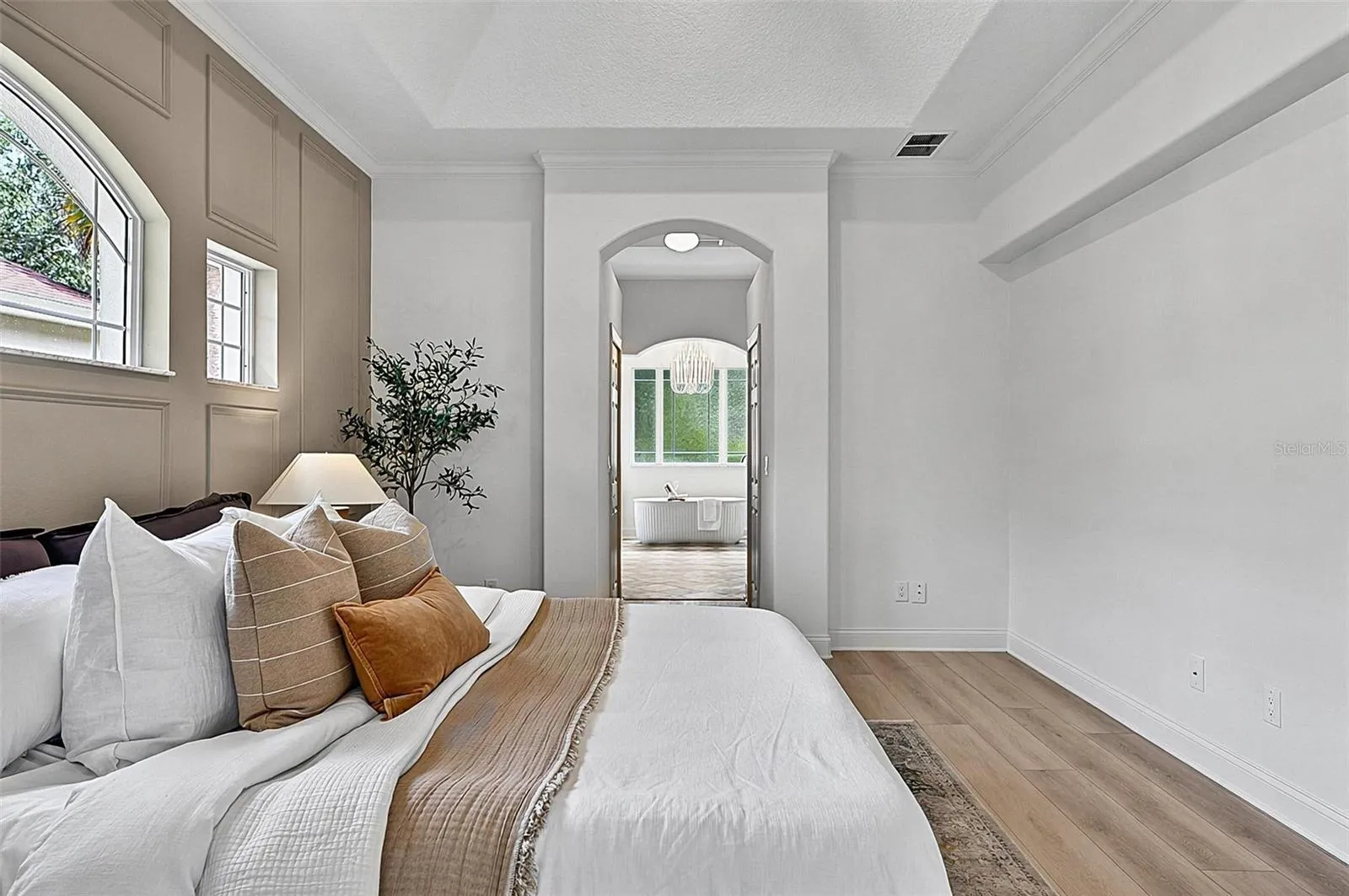 A piece of heaven in the Master Bedroom Retreat with transient window bringing in natural light. Sliders go out to the solarium and into stunning Master Bath Retreat