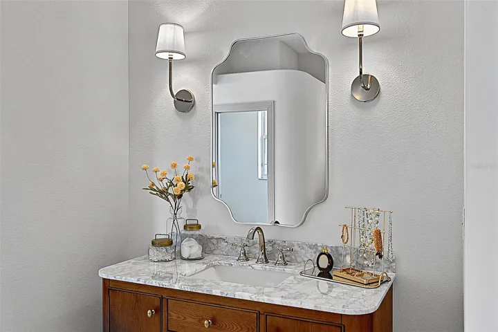 Master Bathroom with wood side ladies stone top with wood vanity