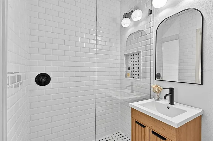 4th Bedroom private bath with vanity and tile shower