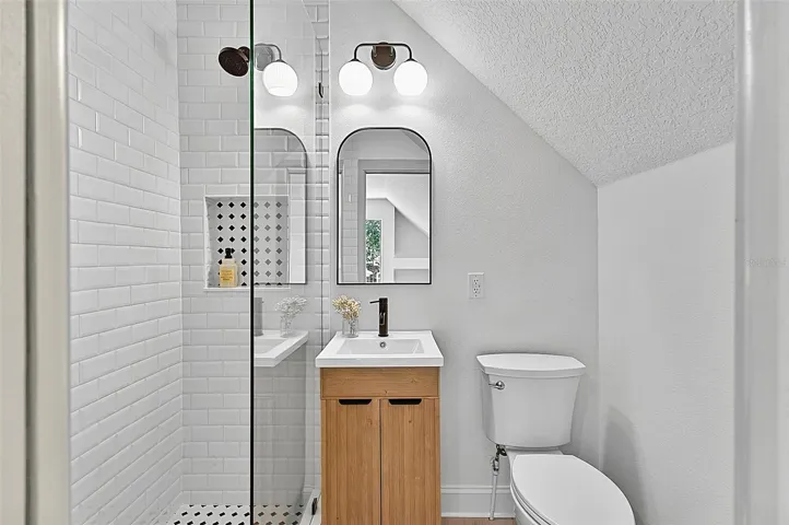 4th Bedroom private bath with vanity and tile shower