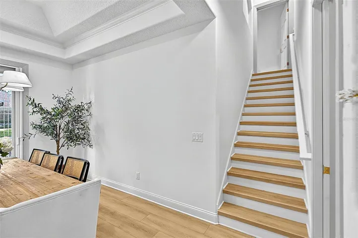 Formal Dining room with stairway to 4th Bedroom with en-suite