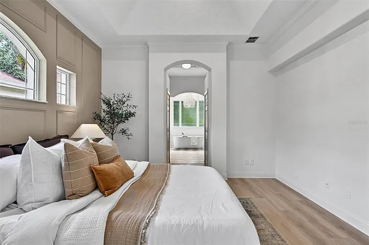 A piece of heaven in the Master Bedroom Retreat with transient window bringing in natural light. Sliders go out to the solarium and into stunning Master Bath Retreat