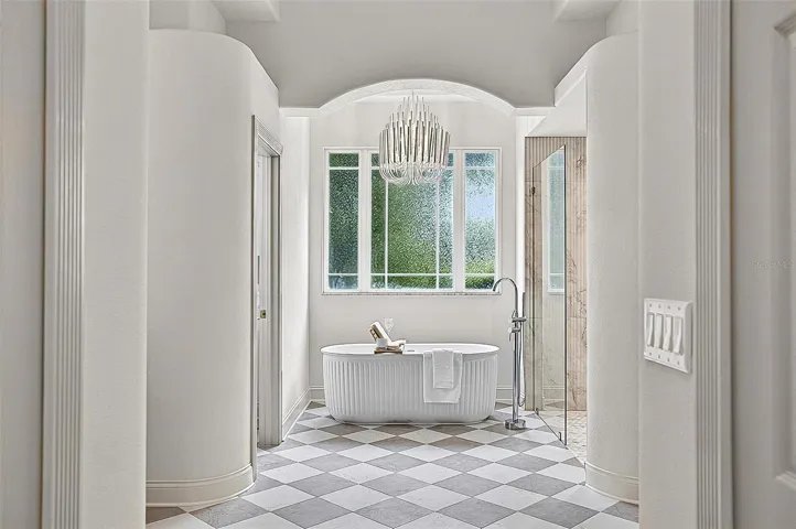 Looking like an upscale magazine, this formal Master Bath gives all the spa vibes
