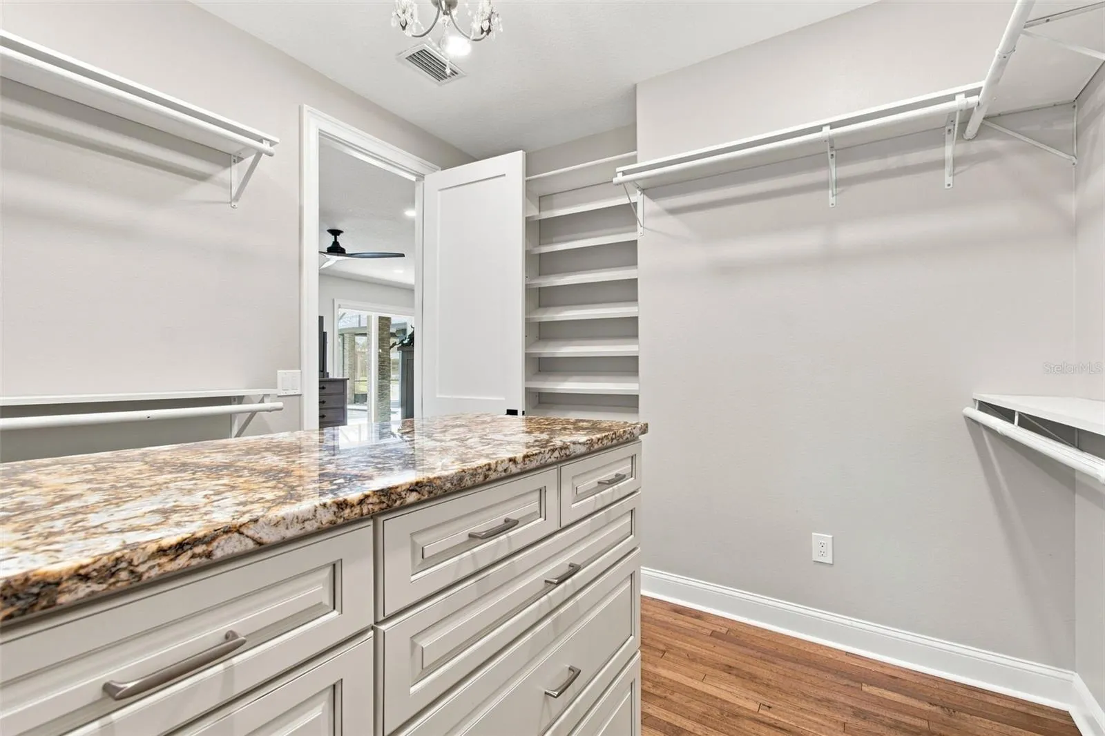 PRIMARY CLOSET WITH CUSTOM JEWELRY DRAWERS