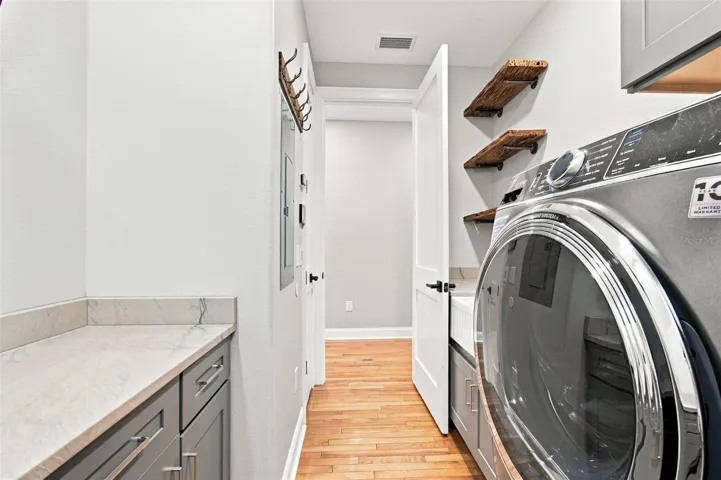 LAUNDRY ROOM SINK AND PECKY CYPRESS SHELVES