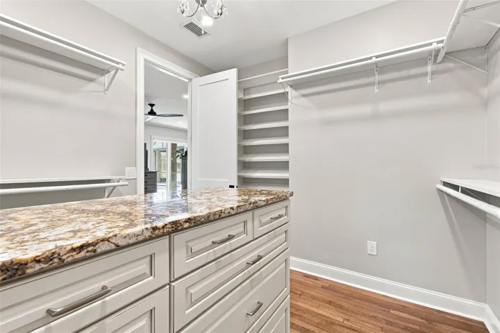 PRIMARY CLOSET WITH CUSTOM JEWELRY DRAWERS