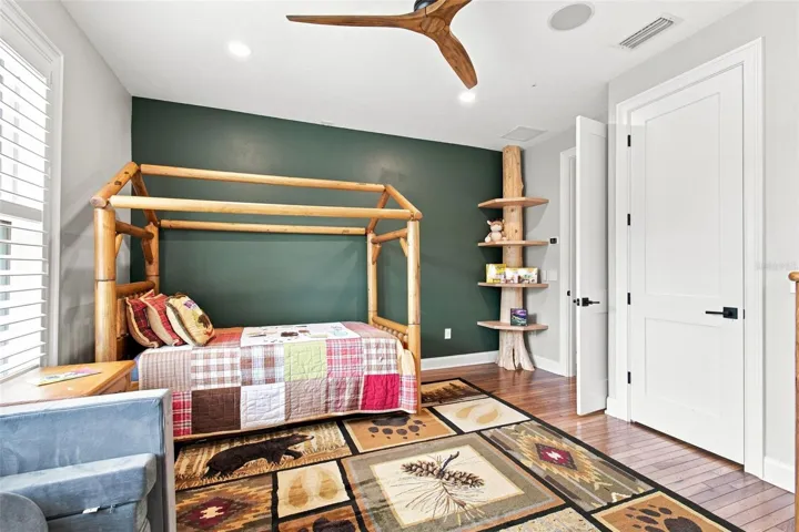THAT TREE BOOKSHELF WAS BROUGHT ACROSS THE US AND CUSTOM MADE FROM A LIVE TREE