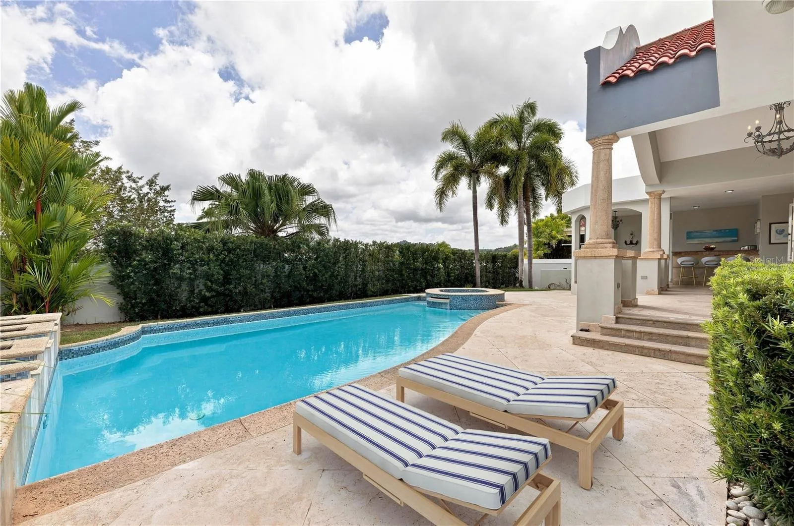 Pool Area - This image has been virtually staged and does not reflect the current state of the property. Pool Area - This image has been virtually staged and does not reflect the current state of the property.